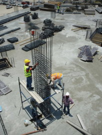 a group of men standing on top of a construction site